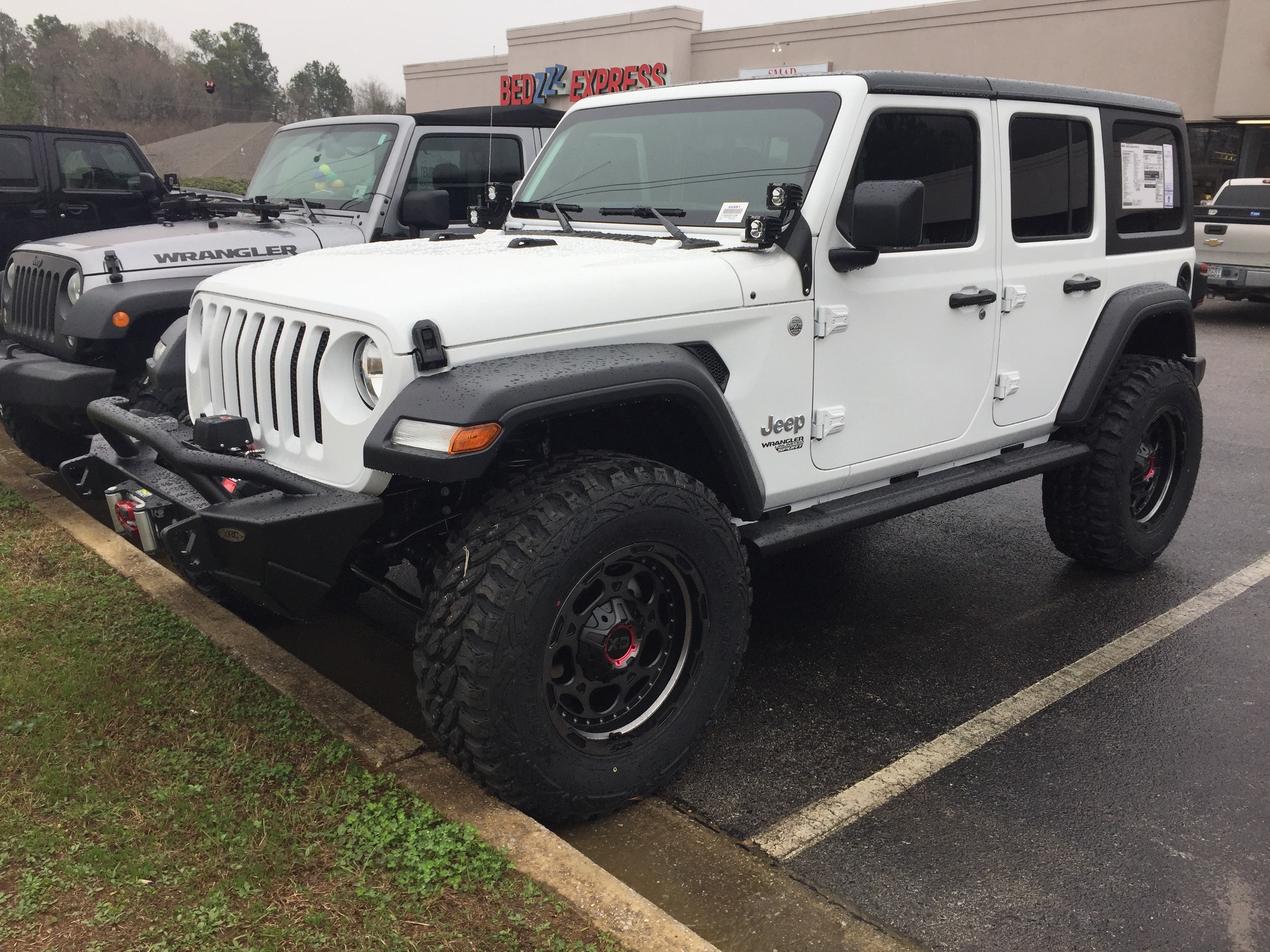 lifted JK Wrangler 2014 Dune color with Atlas bumpers from DSI